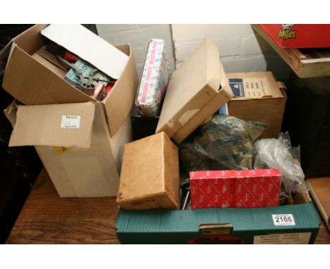 Two boxes containing a small collection of live steam locomotive castings including steam box cover and wheel chassis togethe