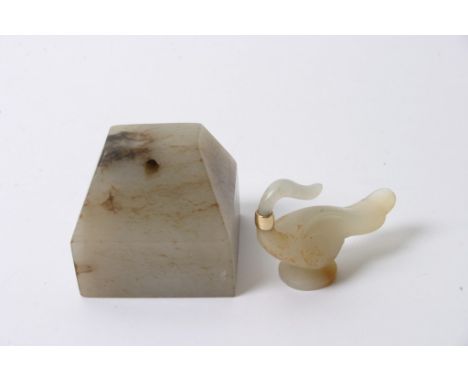 A carved jade figure of a bird together with a jade seal.