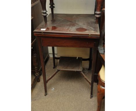 An Edwardian mahogany envelope card table 