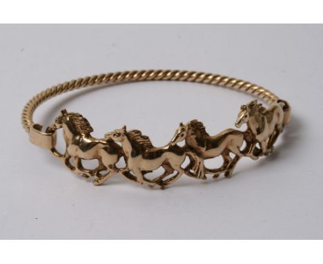 A gold bangle formed as a row of horses 