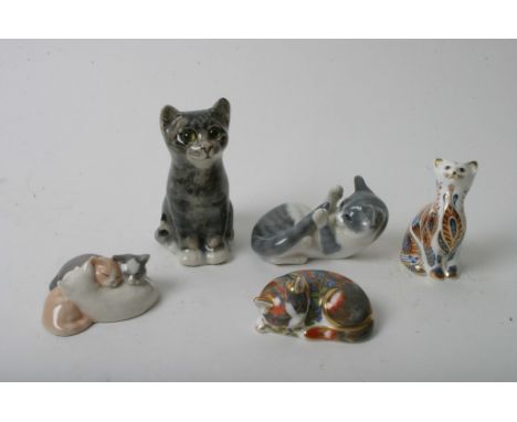 Five ceramic figures of cats to include examples by Royal Crown Derby, Royal Copenhagen and others.