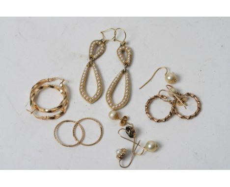 A collection of gold earrings and other pearl set earrings 