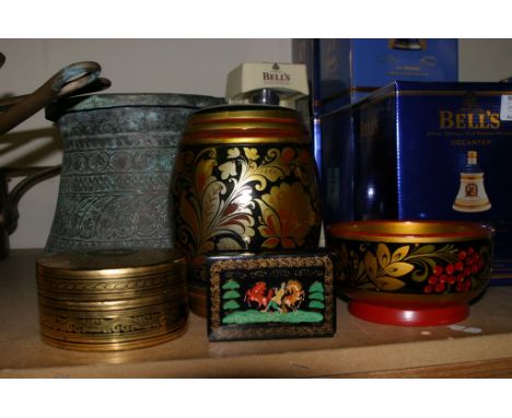 A signed Russian or Soviet painted lacquered box depicting a man playing a flute and two colourful horses dancing to the musi