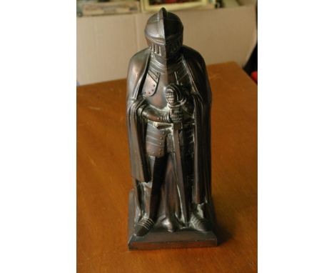 A desk top lighter formed as a knight