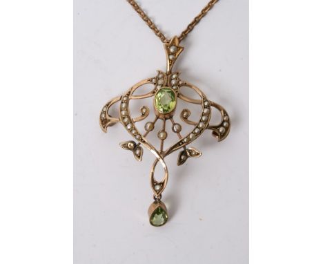 A 9ct gold Edwardian pendent set with a tourmaline and seed pearl 