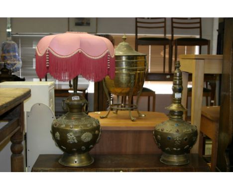 Two similar Eastern brass table lamp bases inlaid with semi precious stones and applied brass decoration one with pink shade 