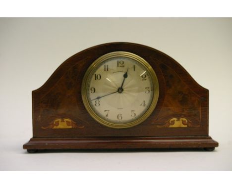 An inlaid mantle clock 