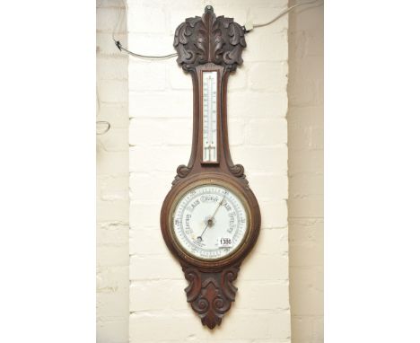 An oak android barometer with a mercury thermometer box 
