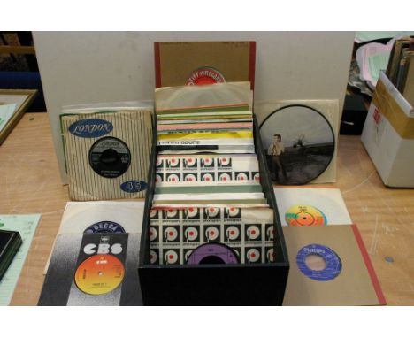 A box of 45 rpm singles including The Beatles, Rolling Stones, Reggae, Bob Dylan etc