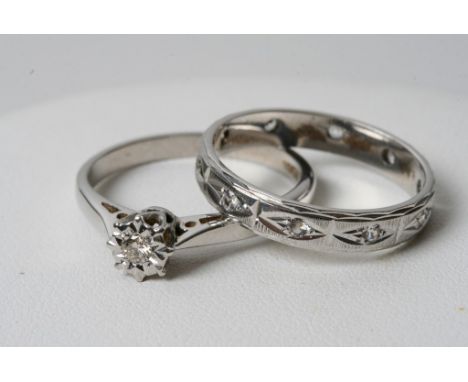 An 18ct white gold diamond ring with a conforming 18ct white gold eternity ring 