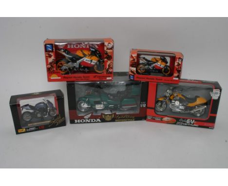 Five boxed scale model die cast Motorbikes ,various scale and makers as new