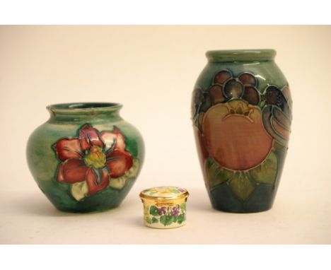 An early Moorcroft pot decorated in the old Anemone pattern and the Pomegranate pattern and an enamel miniature pot (3)  (dam