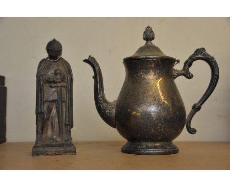 A table lighter in the form of a knight and a silver coloured jug