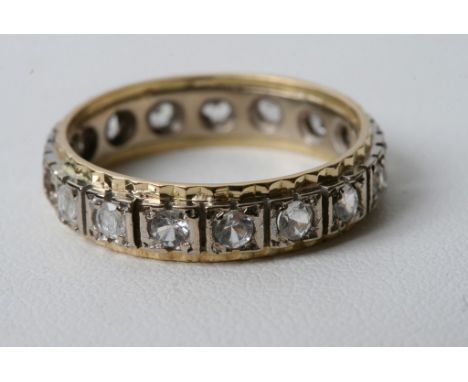 A 9ct gold eternity ring with white stones 