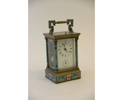 An enamel carriage clock, the dial with Roman numerals and second subsidiary dial 