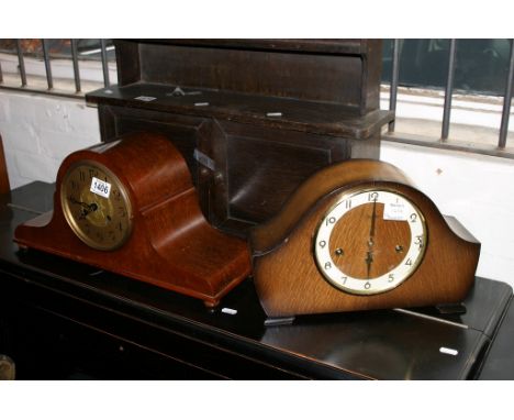 A mahogany mantle clock with another of oak