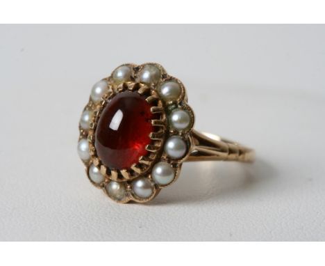 A vintage 9ct gold ring inset with a cabochon and seed pearl 