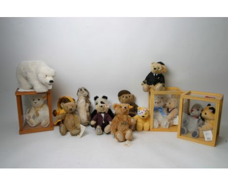 A large collection of teddy bears including modern Merrythought and Steiff examples.