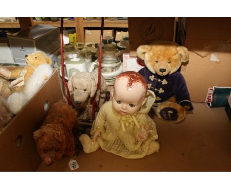 An early 20th century straw filled bear on wheels with stitched nose and glass eyes possibly Steiff