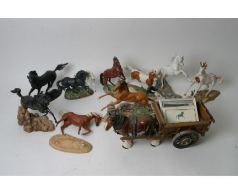A collection of ten ceramic figures of horses.