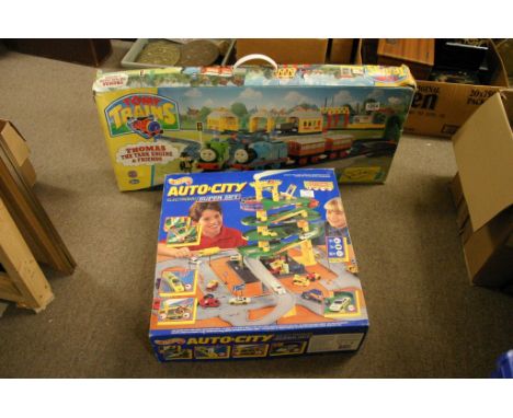A boxed Thomas the tank engine together with a boxed hot Wheels auto city set 