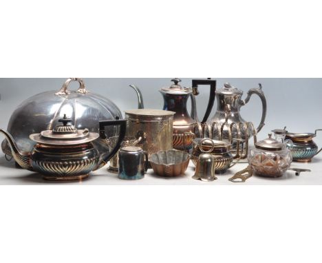 A collection of 20th century silver plated items to include two large leat covers, teapot and hot water jug, toast rack, bisc