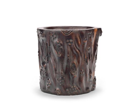 A HARDWOOD 'TREE-TRUNK' BRUSHPOT, BITONG20th centuryThe cylindrical vessel naturalistically carved simulating a gnarled trunk
