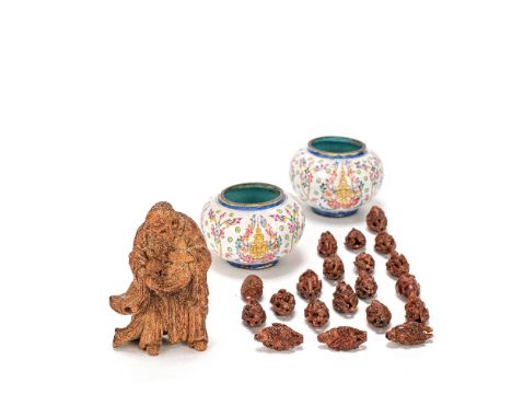 TWENTY NUT CARVINGS, A BAMBOO FIGURE OF A SAGE AND TWO PAINTED ENAMEL WASHERS18th Century and laterComprising: twenty differe