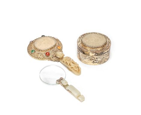 A GROUP OF JADE-MOUNTED PLAQUES AND BELT HOOKS18th/19th centuryComprising: a silver hand mirror inset with hardstone cabochon