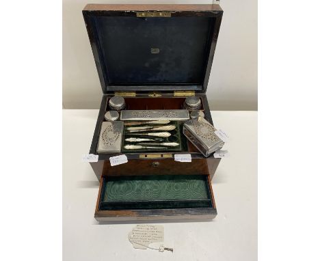 A antique Mechi London Walnut fitted travelling vanity case, with contents to include, manicure items, glass jars (damage to 