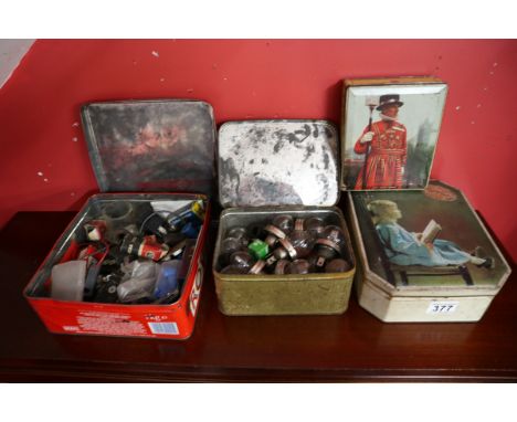 Collection of old automobile bulbs &amp; 4 old biscuit tins 