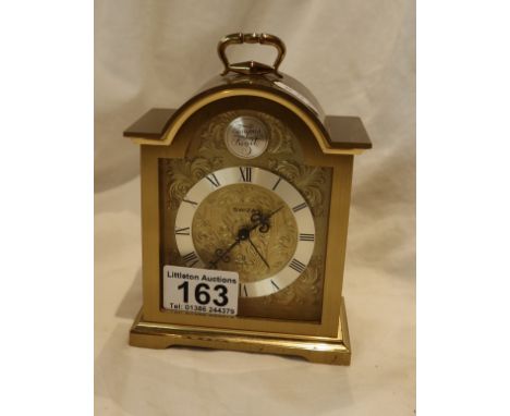 Heavy gilt brass cased clock by Swiza