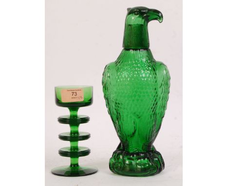 A god Wedgwood green glass candlestick holder in the Sheringham pattern being designed by Ronald Stennet Wilson together with