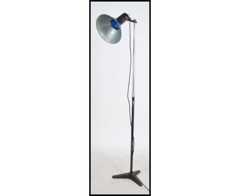 A  good Industrial tripod light in black colourway with large pendant shade and lamp on metal column with tripod base below. 