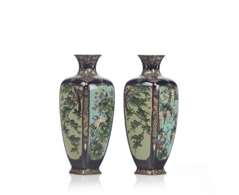 A pair of Japanese vasesCloisonné metal Polychrome decoration of flowering gardens, cranes, eagles and other birds Meiji Peri