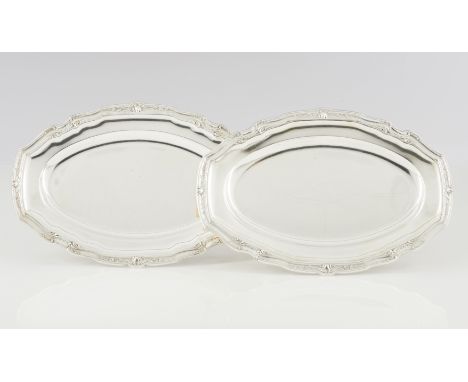 A pair of scalloped serving plattersSilver 800/000Plain centre of shells and foliage motifs reliefs frieze to lipBack inscrib