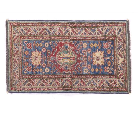 A Ziegler rug, PakistanWool and cotton of geometric pattern in bordeaux and blue shades(wear)88x60 cm