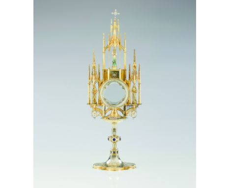 A neogothic style monstranceGilt silverEngraved and chased decorationApplied enamel elements and set with rose cut and crowne