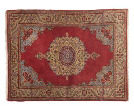 A Tabriz rug, IranWool and cotton of floral pattern in bordeaux and beige shades202x142 cm