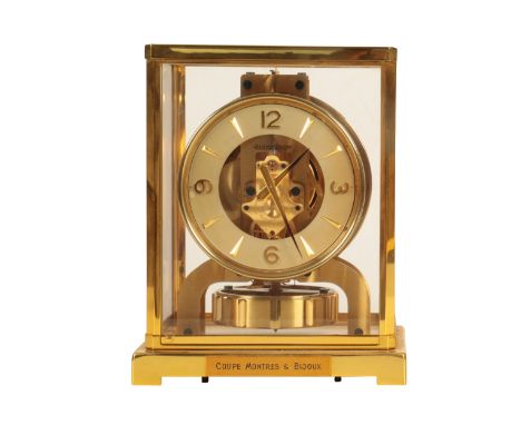   JAEGER -LECOULTRE: AN 'ATMOS' BRACKET CLOCK the white dial with Roman numerals, in a lacquered brass and glazed case on bra