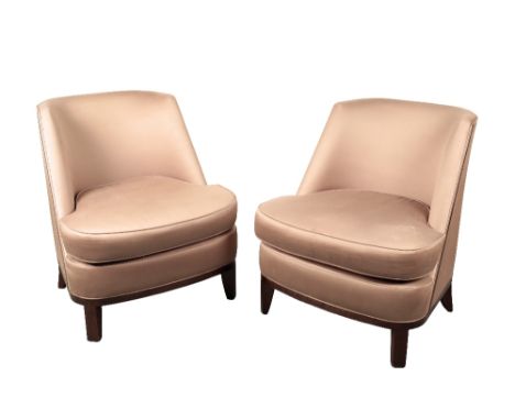  A PAIR OF CUSHIONED LOUNGE CHAIRS in light brown satin effect upholstery with stained wood tapering legs, 77cm wide, 88cm hi