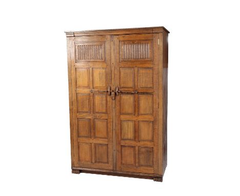 * NIGEL GRIFFITHS: A HANDMADE OAK WARDROBE of Jacobean style, the front with twin panelled doors&nbsp;&nbsp;and a primitive s
