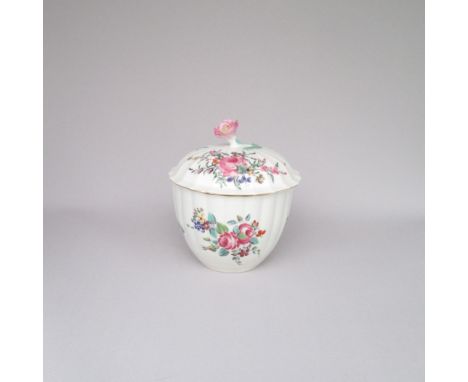 An eighteenth century Worcester porcelain sucrier and cover with a flower head finial decorated with floral sprays of English