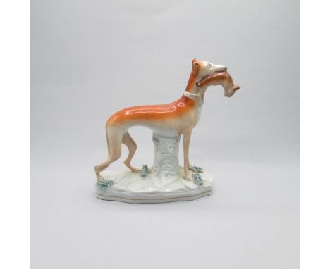 A Staffordshire fine model of a Greyhounds holding a hare in its mouth.Date: Circa 1860       Size: 28cm H x 23cm WCondition:
