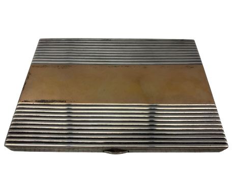 French silver and parcel gilt cigarette case by Chaumet et Cie, the interior with presentation inscription dated 24-3-45, the