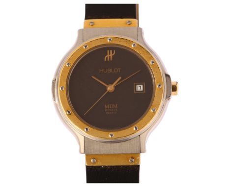 HUBLOT - a lady's stainless steel and gold MDM quartz calendar wristwatch, ref. S.139.10.2, black dial with applied gilt Hubl