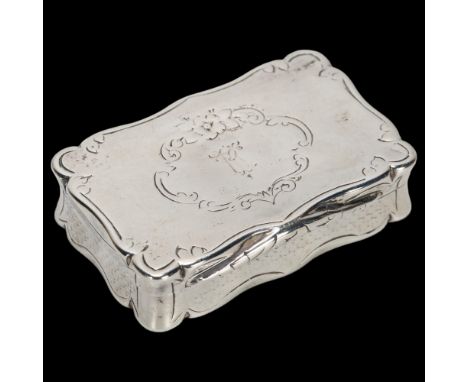 A Victorian rectangular silver snuffbox, Colen Hewer Cheshire, Birmingham 1869, shaped form with engine turned decoration, ca