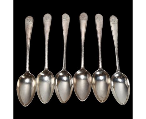 A set of 6 George III Irish silver feather edge pattern dessert spoons, John Power, Dublin 1779, engraved rampant lion with a