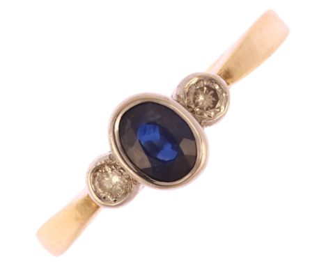 A modern 9ct gold three stone sapphire and diamond ring, bezel set with oval mixed-cut sapphire and modern round brilliant-cu