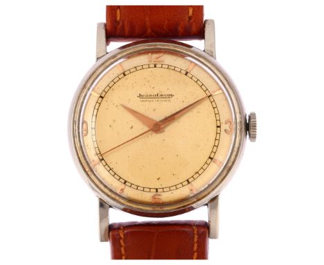 JAEGER LECOULTRE - a Vintage stainless steel mechanical wristwatch, circa 1950s, silvered dial with gilt quarterly Arabic num